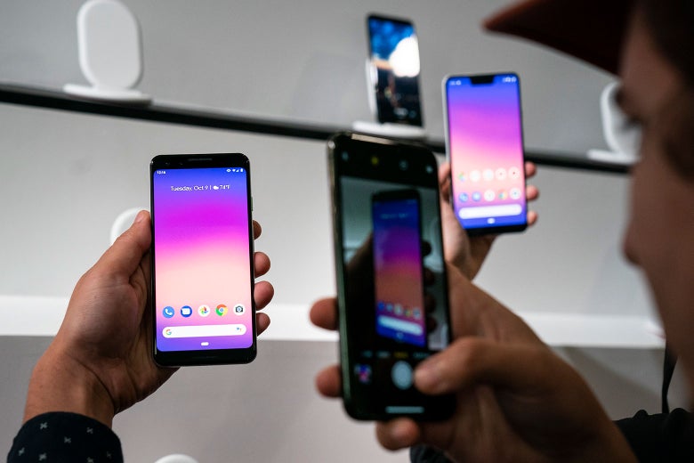 A person taking a photo of the Google Pixel 3 smartphone.